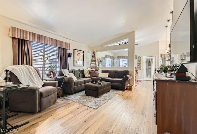3473 Conough Ln, Las Vegas, NV 89129 - living room with light wood-style floors, healthy amount of natural light, and vaulted ceiling