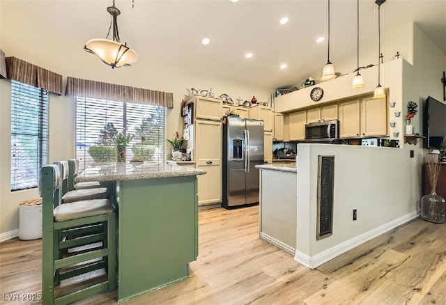 3473 Conough Ln, Las Vegas, NV 89129 - kitchen featuring appliances with stainless steel finishes, light wood finished floors, a peninsula, recessed lighting, and baseboards