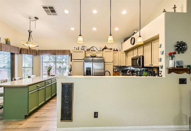 3473 Conough Ln, Las Vegas, NV 89129 - kitchen featuring appliances with stainless steel finishes, green cabinetry, light wood-type flooring, a peninsula, and recessed lighting