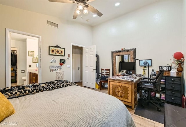 3473 Conough Ln, Las Vegas, NV 89129 - bedroom with a desk, wood finished floors, ensuite bathroom, a ceiling fan, and recessed lighting