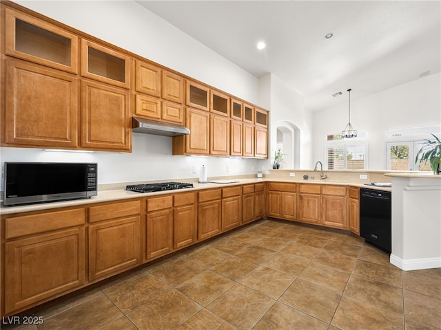 5120 Mirage Garden St, Las Vegas, NV 89130 - kitchen with black appliances, under cabinet range hood, a sink, light countertops, and a peninsula