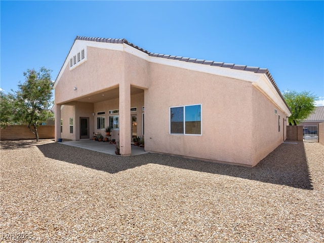 5120 Mirage Garden St, Las Vegas, NV 89130 - back of house with a patio area, a fenced backyard, and stucco siding