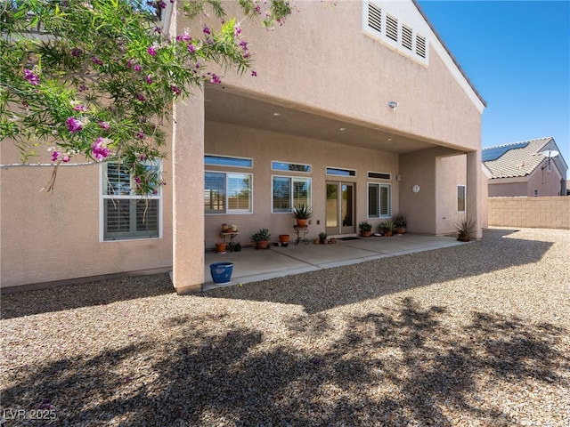 5120 Mirage Garden St, Las Vegas, NV 89130 - back of house with stucco siding and a patio