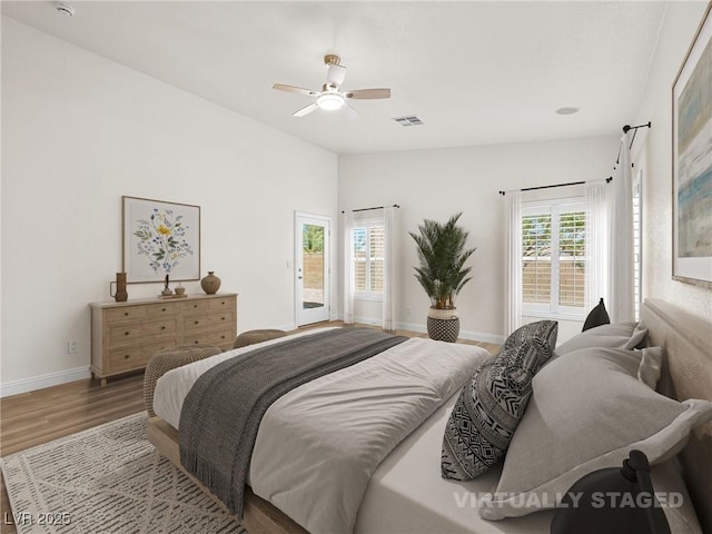 5120 Mirage Garden St, Las Vegas, NV 89130 - bedroom with wood finished floors, baseboards, access to outside, and a ceiling fan