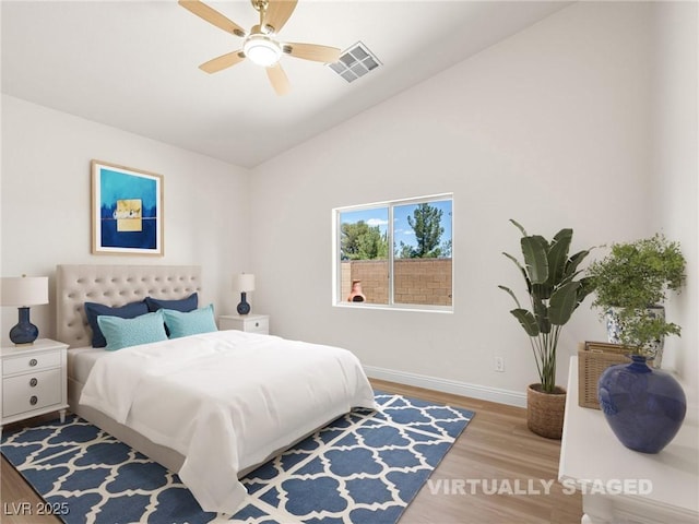 5120 Mirage Garden St, Las Vegas, NV 89130 - bedroom with wood finished floors, lofted ceiling, baseboards, and a ceiling fan