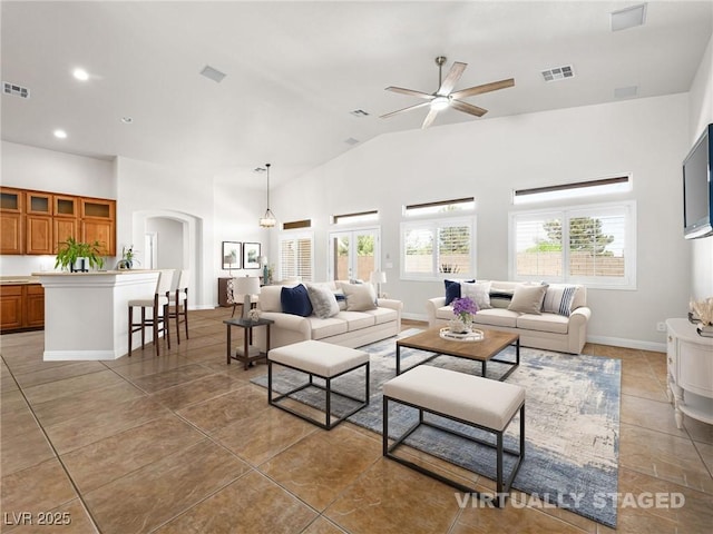 5120 Mirage Garden St, Las Vegas, NV 89130 - living room with a ceiling fan, tile patterned floors, arched walkways, recessed lighting, and high vaulted ceiling