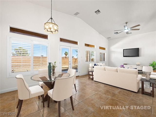 5120 Mirage Garden St, Las Vegas, NV 89130 - tiled dining area with a chandelier, high vaulted ceiling, baseboards, and a ceiling fan