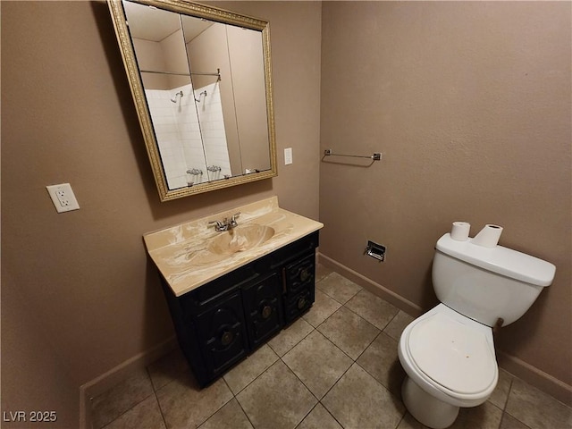 377 N 16th St, Las Vegas, NV 89101 - bathroom with vanity, baseboards, toilet, and tile patterned flooring