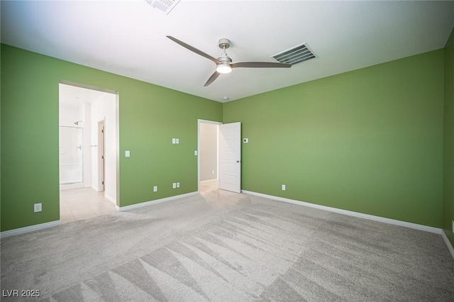 871 Aurelie Ridge St, Henderson, NV 89011 - unfurnished bedroom featuring light carpet, baseboards, connected bathroom, and a ceiling fan