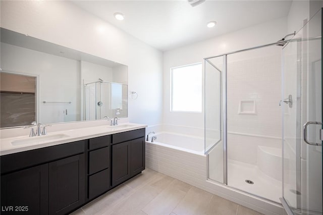 871 Aurelie Ridge St, Henderson, NV 89011 - full bathroom featuring a stall shower, double vanity, a bath, and tile patterned floors