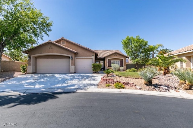 1274 Doggett Ave, Las Vegas, NV 89123 - mediterranean / spanish house featuring stucco siding, a garage, a tiled roof, and concrete driveway