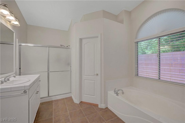 4197 Bottiglia Ave, Las Vegas, NV 89141 - full bathroom featuring vanity, a bath, a stall shower, and tile patterned floors