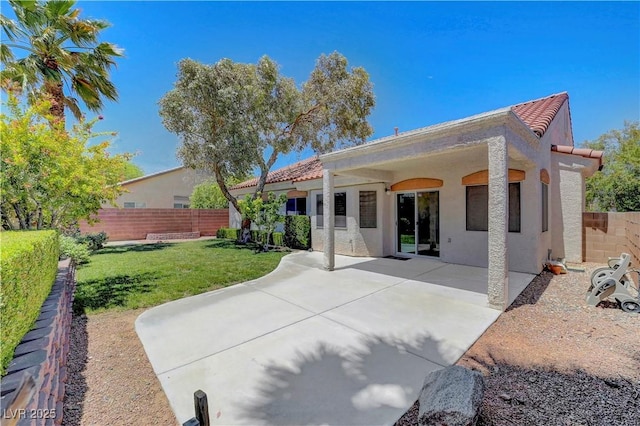 4197 Bottiglia Ave, Las Vegas, NV 89141 - rear view of house with stucco siding, a tiled roof, and a patio area