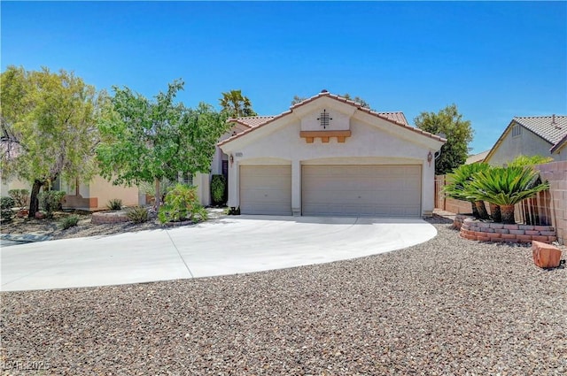 4197 Bottiglia Ave, Las Vegas, NV 89141 - mediterranean / spanish-style house with driveway, an attached garage, stucco siding, and a tile roof