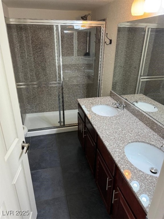 2212 Sunfish Dr Unit D, Henderson, NV 89014 - bathroom featuring double vanity, a shower stall, and tile patterned floors