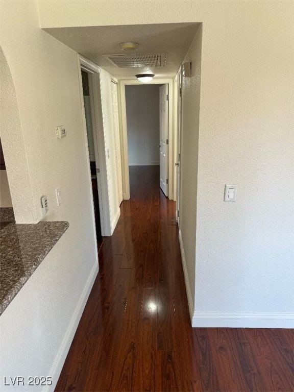 2212 Sunfish Dr Unit D, Henderson, NV 89014 - hallway with wood finished floors, baseboards, and arched walkways