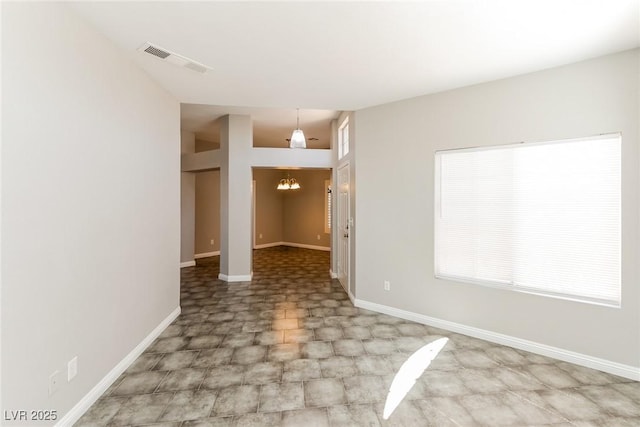 472 Tiger Lily Way, Henderson, NV 89015 - empty room with a chandelier and baseboards