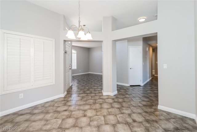 472 Tiger Lily Way, Henderson, NV 89015 - unfurnished room featuring a chandelier and baseboards
