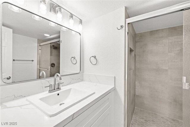 3111 Bel Air Dr Unit 24G, Las Vegas, NV 89109 - full bathroom featuring a shower stall and vanity