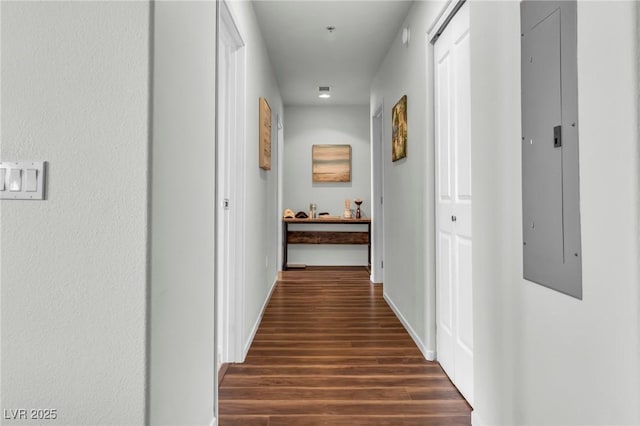 8255 Las Vegas Blvd Unit 719, Las Vegas, NV 89123 - hallway featuring dark wood finished floors, electric panel, and baseboards