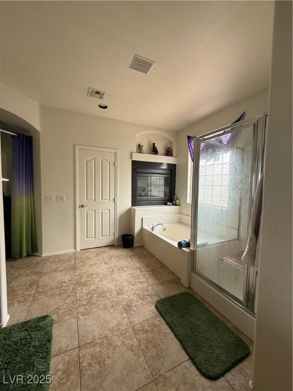 11457 Steponia Bay St, Las Vegas, NV 89141 - bathroom with a bath, tile patterned floors, and a shower stall