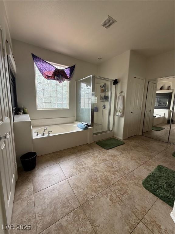 11457 Steponia Bay St, Las Vegas, NV 89141 - full bath featuring a stall shower, a garden tub, and tile patterned floors
