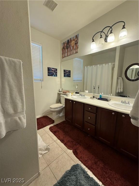 11457 Steponia Bay St, Las Vegas, NV 89141 - bathroom featuring tile patterned flooring and double vanity