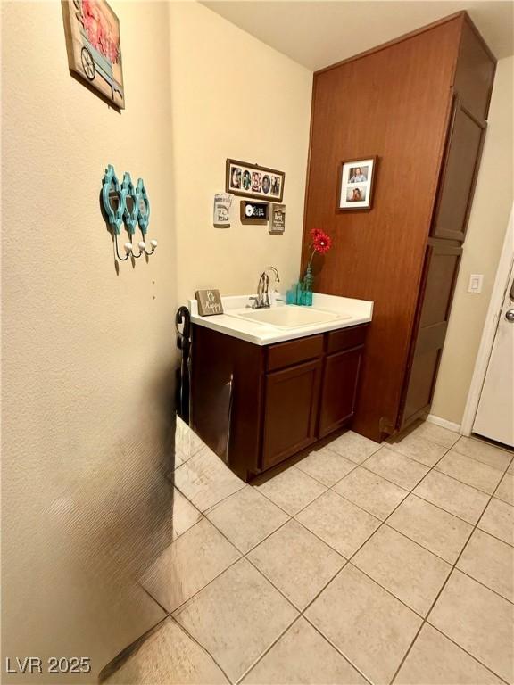 11457 Steponia Bay St, Las Vegas, NV 89141 - bathroom featuring tile patterned floors and vanity
