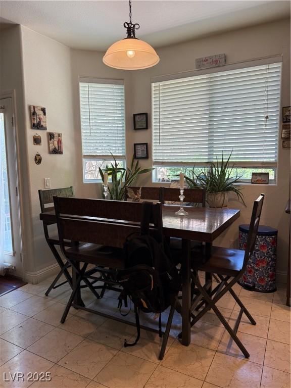 11457 Steponia Bay St, Las Vegas, NV 89141 - dining area with light tile patterned floors