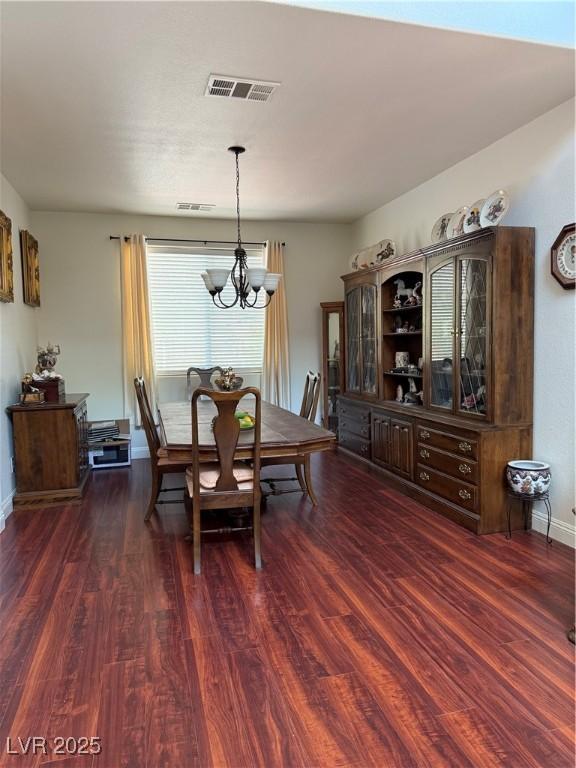 11457 Steponia Bay St, Las Vegas, NV 89141 - dining space featuring a chandelier and dark wood finished floors