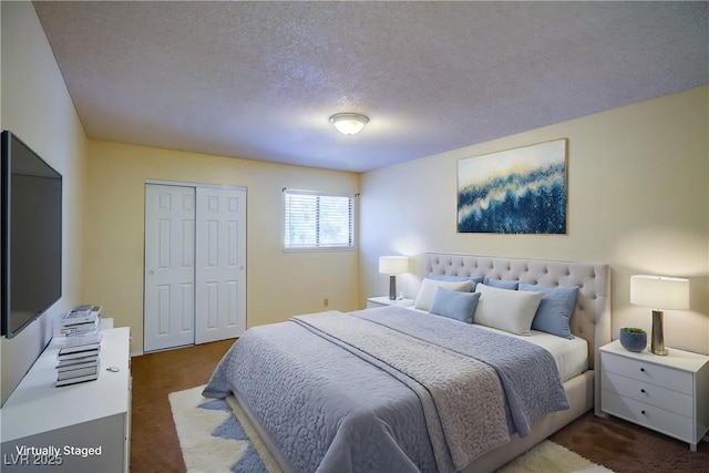 1316 Capri Drive A,B,C,&D, Boulder City, NV 89005 - bedroom with dark colored carpet, a closet, and a textured ceiling