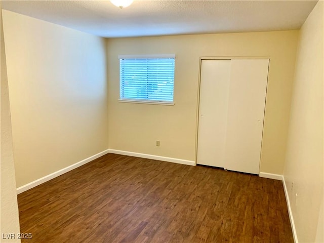 1316 Capri Drive A,B,C,&D, Boulder City, NV 89005 - unfurnished bedroom featuring wood finished floors, baseboards, and a closet