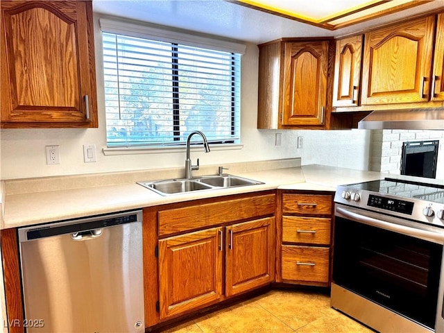 1316 Capri Drive A,B,C,&D, Boulder City, NV 89005 - kitchen featuring stainless steel appliances, a sink, light countertops, and brown cabinets
