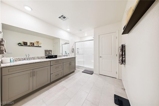 1885 Vass Springs Pl, North Las Vegas, NV 89084 - full bath featuring a stall shower, double vanity, tile patterned flooring, and recessed lighting