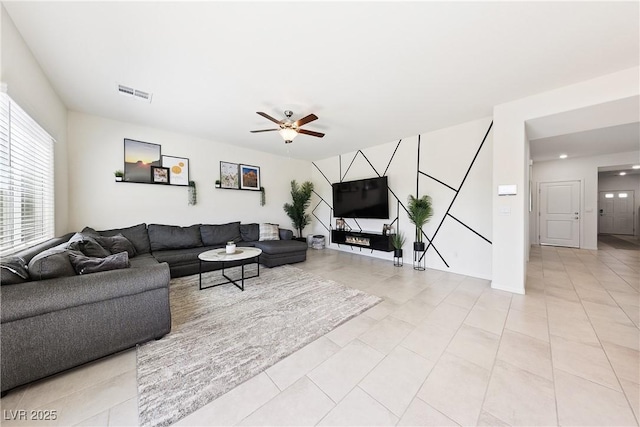 1885 Vass Springs Pl, North Las Vegas, NV 89084 - living room with a ceiling fan and light tile patterned flooring