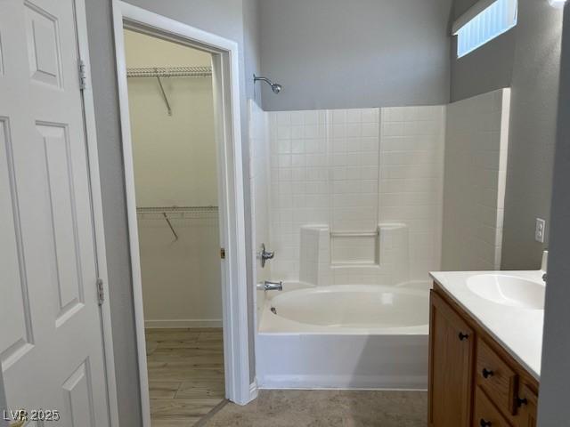 6170 E Sahara Ave Unit 1012, Las Vegas, NV 89142 - full bathroom featuring tub / shower combination, vanity, and a spacious closet