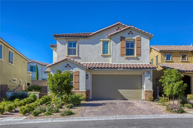 459 Astillero St, Las Vegas, NV 89138 - mediterranean / spanish house with stucco siding, a tiled roof, a garage, and decorative driveway