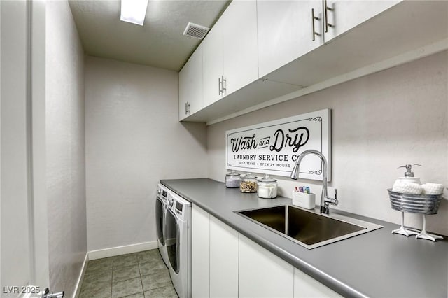 459 Astillero St, Las Vegas, NV 89138 - laundry room featuring cabinet space, washing machine and dryer, baseboards, and light tile patterned floors