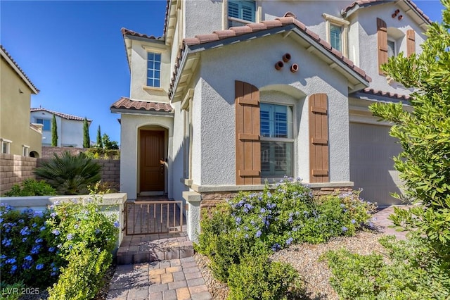 459 Astillero St, Las Vegas, NV 89138 - mediterranean / spanish house featuring a tiled roof, stucco siding, and a garage