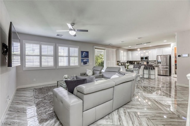 459 Astillero St, Las Vegas, NV 89138 - living area featuring baseboards and a ceiling fan
