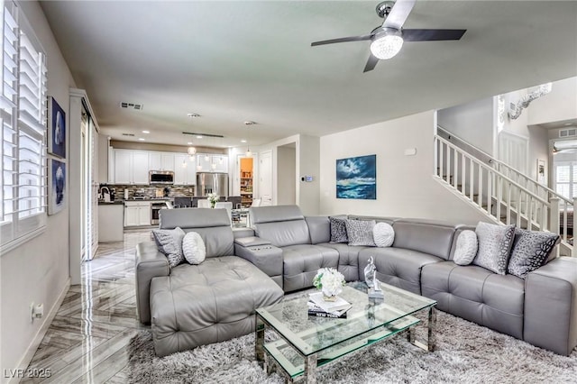 459 Astillero St, Las Vegas, NV 89138 - living area featuring baseboards, stairway, and ceiling fan