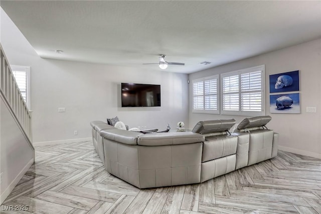 459 Astillero St, Las Vegas, NV 89138 - living room featuring baseboards, a ceiling fan, and stairs