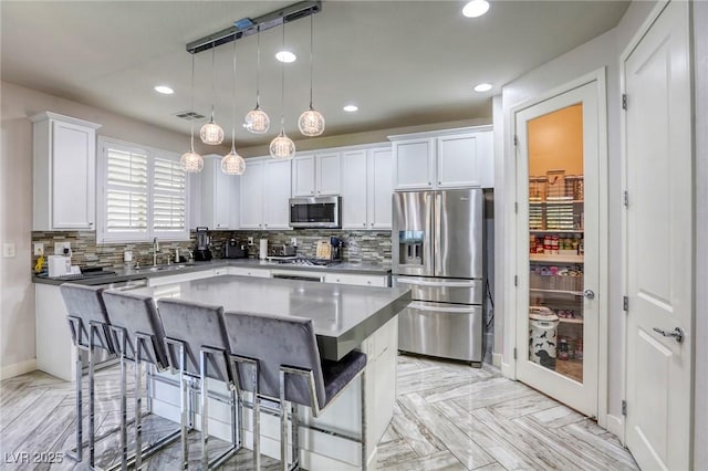 459 Astillero St, Las Vegas, NV 89138 - kitchen featuring stainless steel appliances, recessed lighting, a sink, white cabinets, and tasteful backsplash