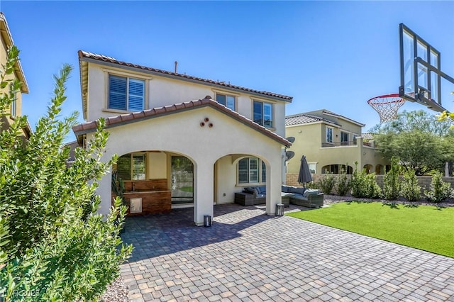 459 Astillero St, Las Vegas, NV 89138 - rear view of property with an outdoor hangout area, stucco siding, a lawn, a tile roof, and a patio