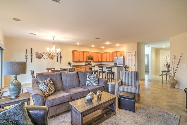 2144 Marywood Park Ct, Henderson, NV 89044 - living area featuring a chandelier, light tile patterned flooring, and recessed lighting