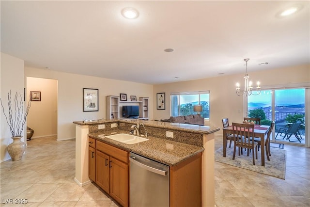 2144 Marywood Park Ct, Henderson, NV 89044 - kitchen featuring stainless steel dishwasher, a sink, a chandelier, open floor plan, and a center island with sink
