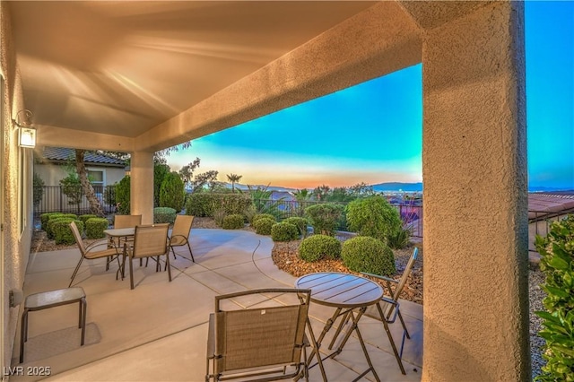 2144 Marywood Park Ct, Henderson, NV 89044 - patio terrace at dusk with outdoor dining space and a patio