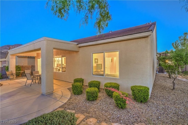 2144 Marywood Park Ct, Henderson, NV 89044 - back of house with stucco siding, a patio area, and cooling unit