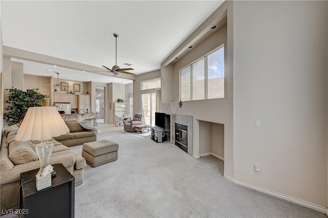 467 Beardsley Cir, Henderson, NV 89052 - living room featuring carpet floors, ceiling fan, a fireplace, baseboards, and recessed lighting