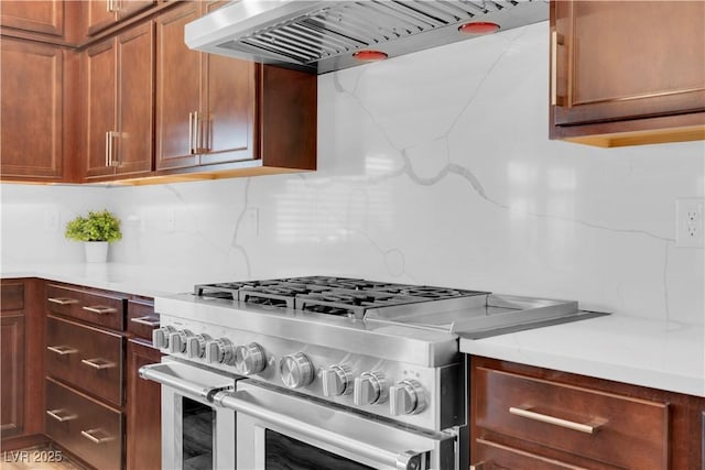 7260 Grace Estate Ave, Las Vegas, NV 89113 - kitchen featuring double oven range, exhaust hood, light countertops, and tasteful backsplash